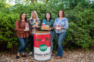 Members of WRVEC’s team prepare for their food drive “Power to Turn Hunger into Hope”.