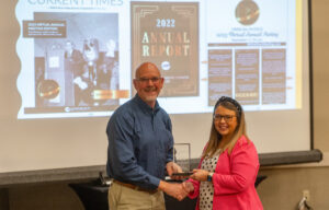 WRVEC Public Relations Coordinator, Shelby Novak, accepts Rural Missouri’s High Voltage Award from Association of Missouri Electric Cooperatives Vice President, Mike Sutherland.