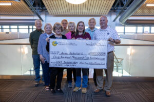 The White River Valley Electric Trust Board presents a check for $102,000 for area students to further their education or vocational career.